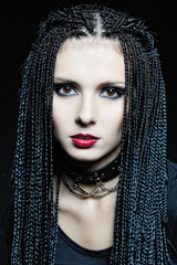 Beautiful woman in gothic shape with african pigtails .