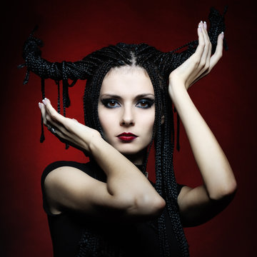 Beautiful woman in carnival costume. witch shape with Horns.