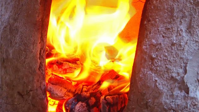 A traditional wood-fired oven is a type of oven that is typically made of brick or clay and is heated by burning wood. 