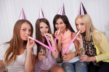 Four attractive females celebrating