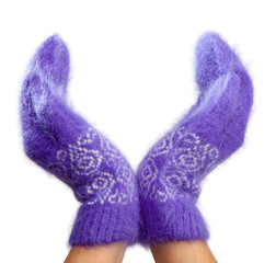 Hands in fluffy lilac mittens