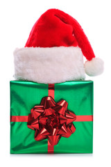 Obraz na płótnie Canvas Santa Claus kapelusz i prezent owinięty obecny