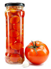 canned tomatoes in glass jars