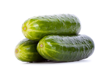 Three shiny cucumbers