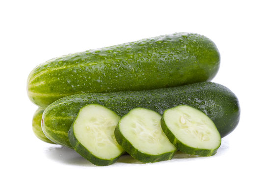 three cucumbers and slices