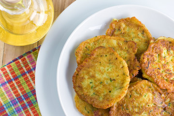 Homemade squash pancakes on the white plate