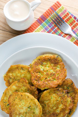Homemade squash pancakes on the white plate
