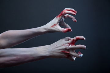 Zombie stretching bloody hands - obrazy, fototapety, plakaty