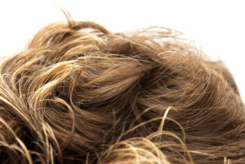 Brunette with curly hair on white background