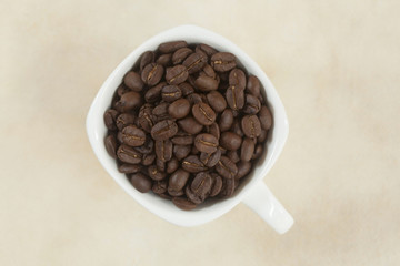 Coffee beans in a cup