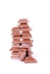 stack of chocolate pieces isolated on white background