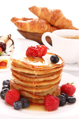 Small pancakes topped with honey