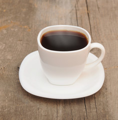 cup of coffee with smoke on brown background