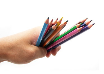 colorful pencils in hand on a white background