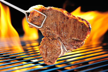 Grilled beef steak on the grill