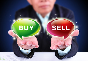 businessman showing buy or sell trading sign