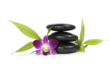 Three zen stones with orchid and bamboo leaf isolated