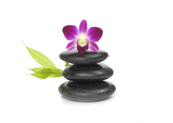 Fototapeta na wymiar Pink orchid, Zen pebbles balance. and bamboo leaf
