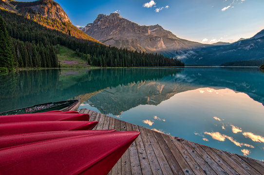 Canoe Dock With Mountain Reflection