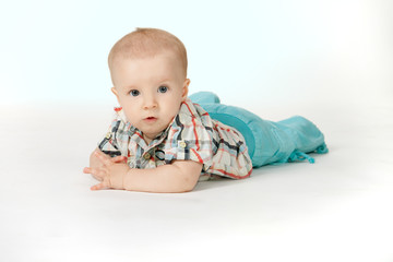 Little stilish boy on the white background