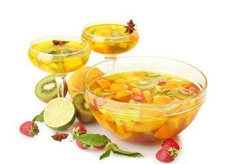 punch in bowl and glasses with fruits, isolated on white