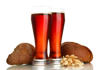 two glasses of kvass and rye breads with ears, isolated on