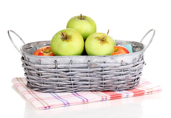 Ripe apples in basket isolated on white