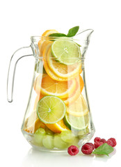 transparent jar with citrus fruits and raspberries, isolated