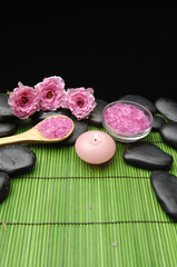 Spa sitting with rose and salt in bowl with candle