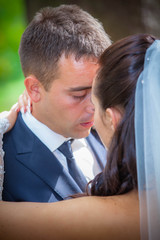 Wedding shot of bride and groom in park