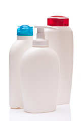 three white blank bottle