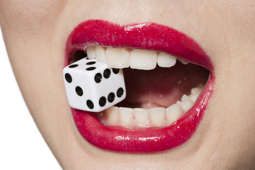 woman biting dice