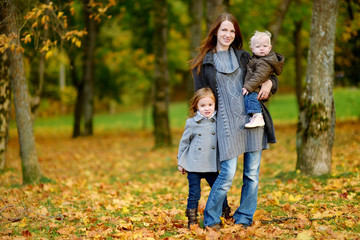 Fototapeta premium Young mother and her two daughters