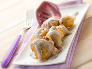 fried cauliflower with cream sauce, selective focus