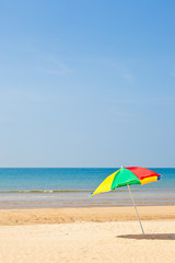 Fototapeta na wymiar Seaside beach umbrella