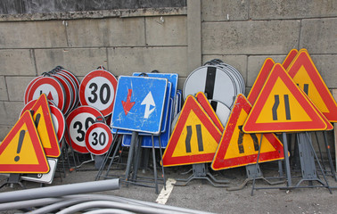 road signs ready to be installed near the road works