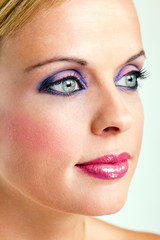 Fototapeta premium beautiful blond woman with stylish violet make-up