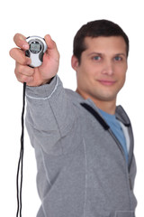 young man holding a chronometer