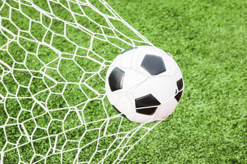 Naklejka na ściany i meble football in the goal net