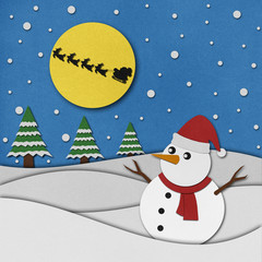 Snowman recycled paper craft on paper background.
