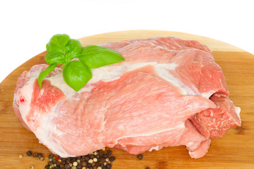 raw meat of pork on wooden board