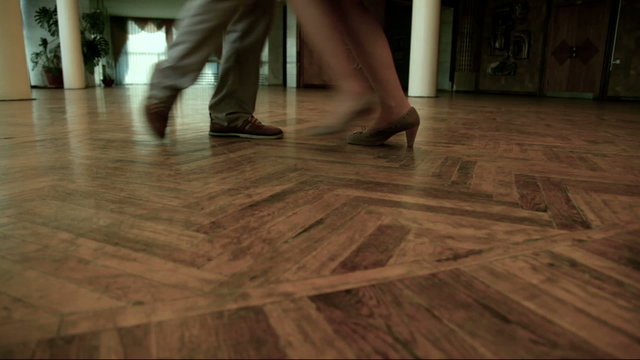 Couples feet doing steps during dance