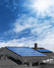 Fototapeta premium Solar panels on house rooftop