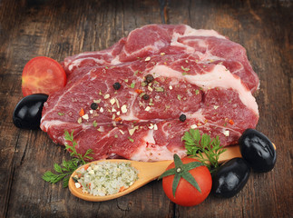 raw steak with spice and tomatoes