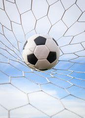 football in the goal net