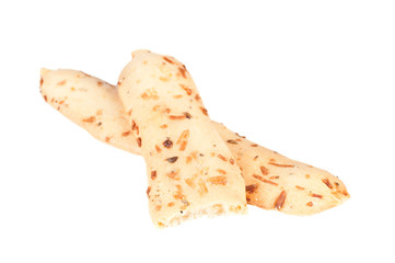 Breadsticks with oregano over a white background