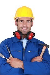 Manual worker with hammer and chisel