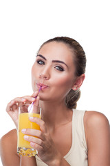 Close-up portrait of happy young woman with juice on white backg