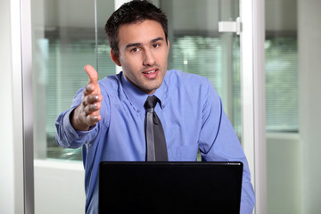 Fototapeta premium Businessman holding his hand out for a handshake
