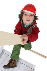 Little boy pretending to be a carpenter